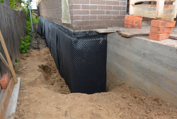 Happy homeowners after waterproofing job in Jemison